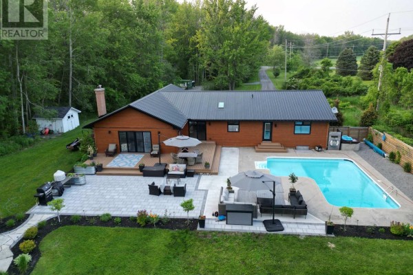 Backyard oasis with pool, hot tub, deck, and patio - 407 County Road 4 Prince Edward County