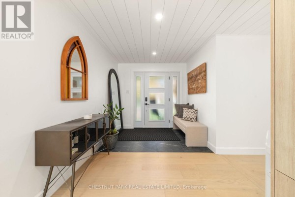 Entryway with bench, console table, and glass-paneled door - 407 County Road 4 Prince Edward County