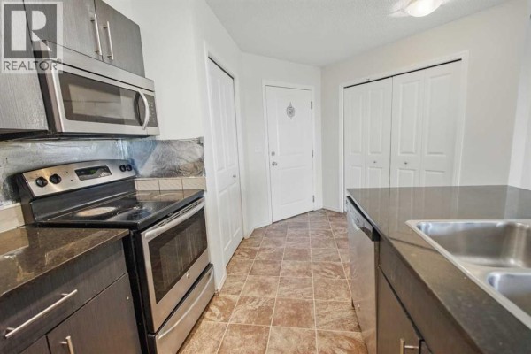 Kitchen - 409, 15 Saddlestone Way Ne, Calgary, AB T3J0S3 Photo 4