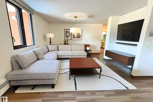 Living room featuring a sectional sofa, coffee table, and modern entertainment unit. - #409 10145 109 St Nw, Edmonton