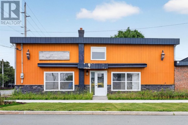Front exterior view of the orange building with a white door and large windows. - 41 Cashin Avenue, St John S