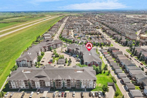 Aerial view showing apartment complex and surrounding residential neighborhoods. - #410 18122 77 St Nw, Edmonton