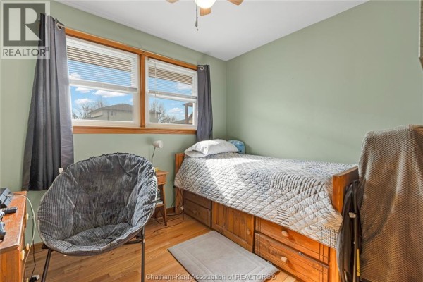Bedroom with bed, TV, and closet - 410 Mcnaughton Avenue East Chatham