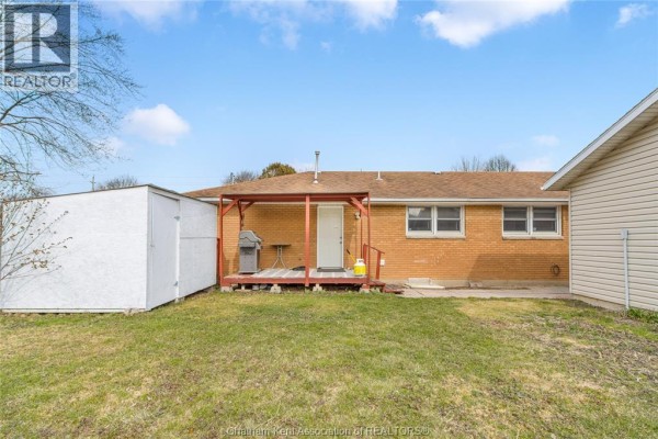 Covered deck with grill, shed, and propane tank - 410 Mcnaughton Avenue East Chatham
