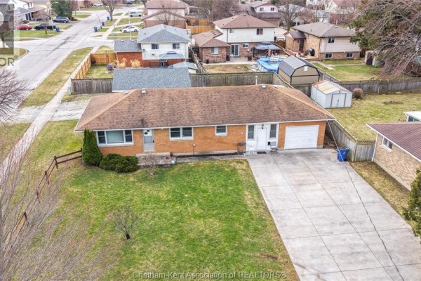 Backyard with shed, covered porch, grill - 410 Mcnaughton Avenue East Chatham
