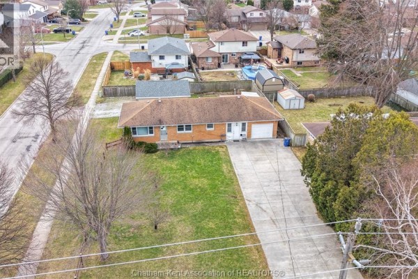 Garage with lawn tractor, motorcycle, bicycles and storage - 410 Mcnaughton Avenue East Chatham