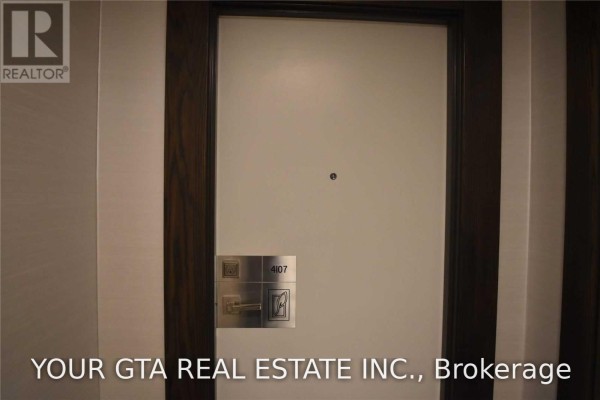 Apartment entrance door with unit number 4107 and peephole. - 4107 - 4011 Brickstone Mews, Mississauga