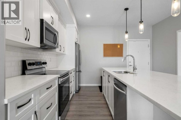 Kitchen - 411, 4350 Seton Drive Se, Calgary, AB T3M3B1 Photo 4