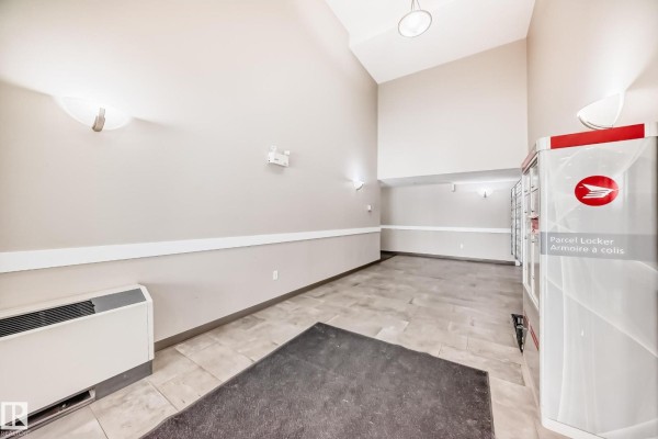 Bathroom with bathtub, toilet, vanity, and tiled floor. - #411 6925 199 St Nw Nw, Edmonton