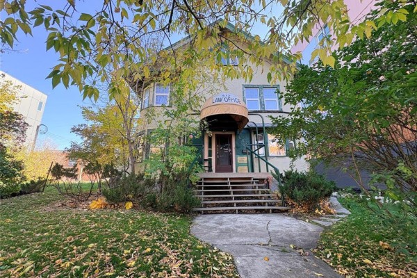 Front entrance of a commercial building with a covered awning and steps leading up to the door. - 412 Wardlaw Avenue, Winnipeg