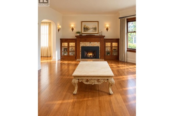 Living room with a fireplace, built-in wood cabinets, and hardwood floors. - 4147 W13th Ave, Vancouver