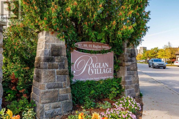 Stone monument sign for Raglan Village at the entrance of the property. - 416 - 91 Raglan Street, Collingwood