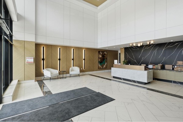 Open kitchen with island, white cabinetry, and large windows for natural light. - 416 1526 Finlay Street, White Rock