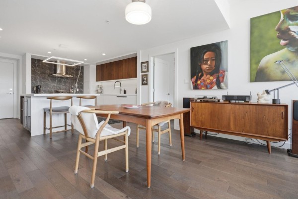 Stylish kitchen with dark wood cabinets, marble backsplash, and stainless steel appliances. - 416 1526 Finlay Street, White Rock