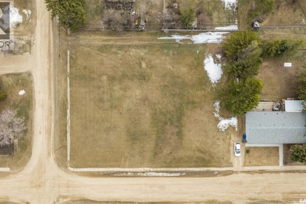 Overhead aerial view of the rectangular lot at a street intersection with a house on one side. - 417 5th Street, Duck Lake