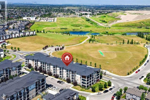 Aerial view of apartment buildings next to parks and residential homes. - 418, 10 Walgrove Walk Se, Calgary