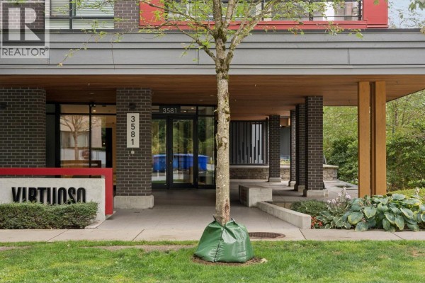 Entrance to apartment building with sign reading Virtuoso. - 418 3581 Ross Drive, Vancouver