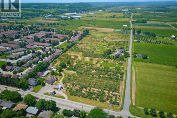 Aerial view of Vineland Station, showing residential areas and expansive farmlands. - 4188 Victoria Avenue, Vineland Station