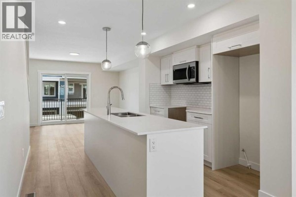 Living room - 42, 200 Belmont Street Sw, Calgary, AB T2X4W8 Photo 3