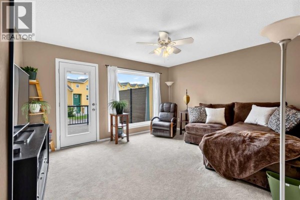 Living room - 42, 7 Westland Road, Okotoks, AB T1S1Z1 Photo 4
