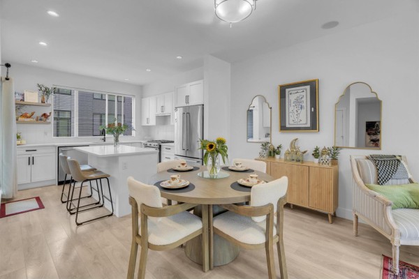 Kitchen with island, dining table, and buffet cabinet. - 42 16433 19 Avenue, White Rock