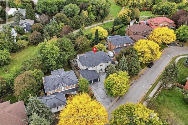 Aerial view of residential street with mature trees and houses. - 42 Dawnridge Trail, Brampton