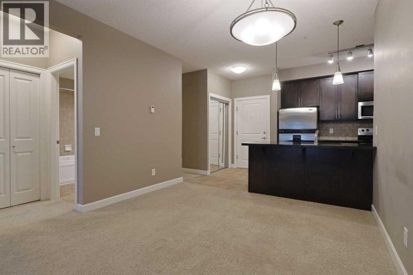 Living room - 421, 88 Arbour Lake Road Nw, Calgary, AB T3G0C2 Photo 3