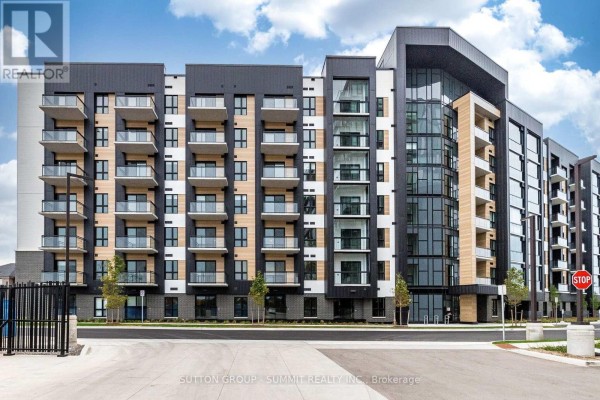 Exterior view of a multi-story apartment building with balconies and dark accents. - 421 - 3008 William Cutmore Boulevard, Oakville