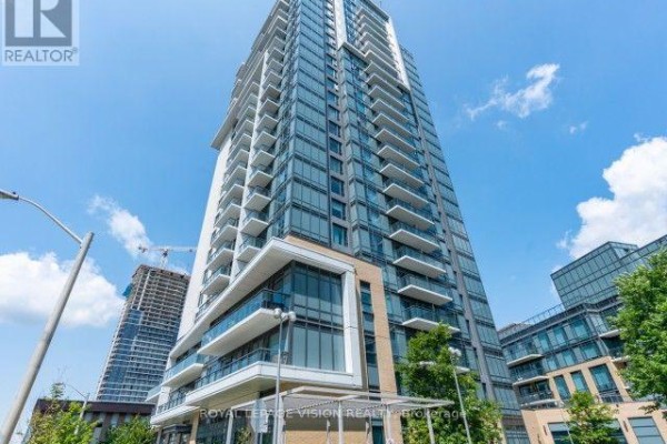 Exterior view of a tall modern condo building with balconies against a blue sky. - 421 - 50 Ann O'reilly Road, Toronto