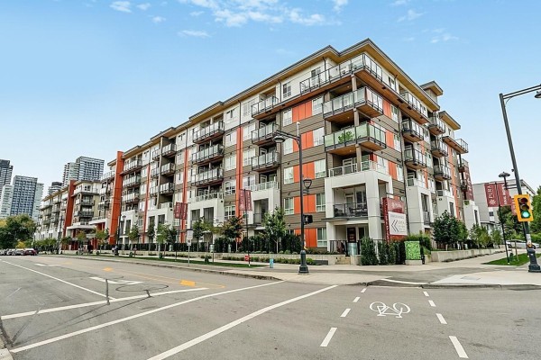 Exterior view of a multi-story apartment building with balconies and balconies. - 421 13238 105 Avenue, Surrey
