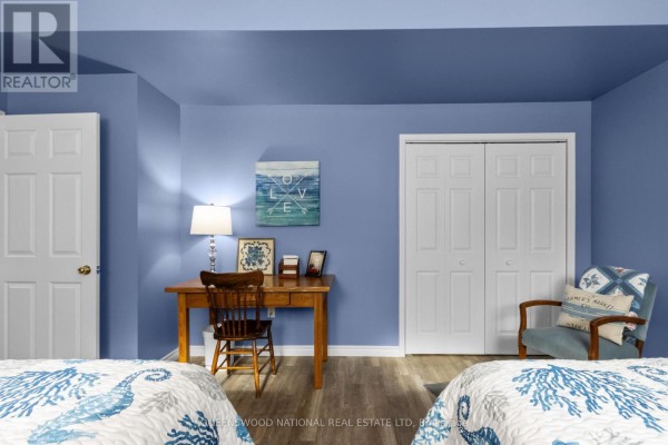 Bedroom with desk, bi-fold closet doors, laminate flooring - 42125 Combermere Road Ne, Madawaska Valley