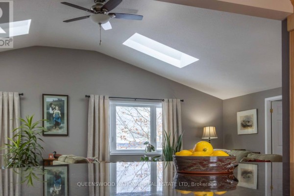 Kitchen counter with vaulted ceiling, skylight, and windows - 42125 Combermere Road Ne, Madawaska Valley