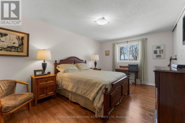 Bedroom with hardwood floors, window, bed - 42125 Combermere Road Ne, Madawaska Valley