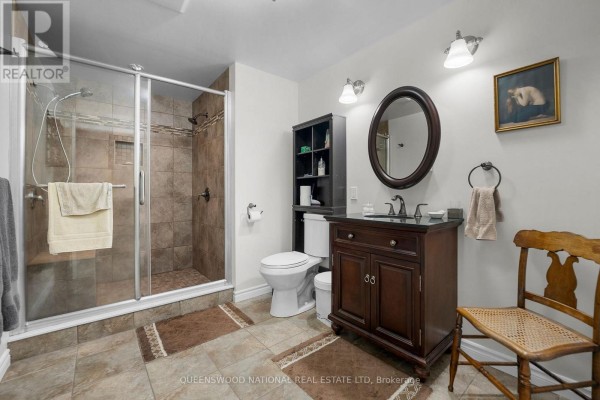 Bathroom with walk-in shower, single vanity, and tiled floor - 42125 Combermere Road Ne, Madawaska Valley