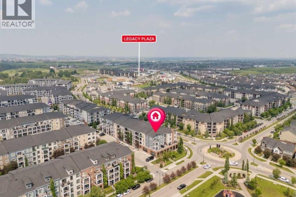 Aerial view of a Calgary residential complex with the building marked, near Legacy Plaza. - 4220, 215 Legacy Boulevard Se, Calgary