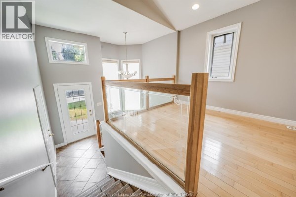 Interior view from staircase looking towards the living area and foyer. - 4231 Whiskey Avenue, Windsor