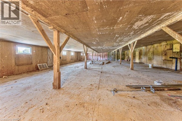 Interior view of an empty commercial space with wood-paneled walls and ceiling. - 428 Lynden Road Unit# Building 4, Upper #1 & #2, Brantford