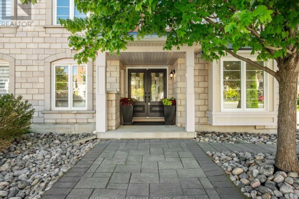 Close-up of townhouse entrance with double doors and stone exterior. - 43 Deans Drive, Toronto