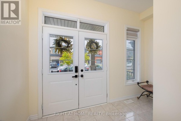 View of the double front doors from inside the foyer with tiled floor. - 43 Vickery Street, Whitby