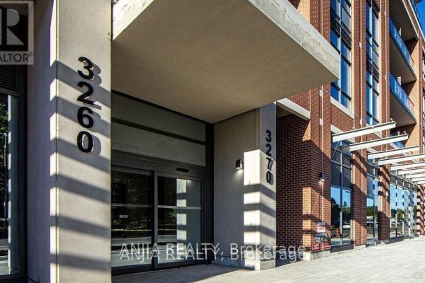 Entrance to apartment building with automatic glass doors and street numbers. - 430 - 3270 Sheppard Avenue E, Toronto