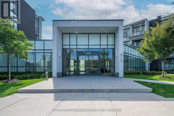 Front entrance to apartment building 415 at Friday Harbour, with glass doors and windows. - 431 - 415 Sea Ray Avenue, Innisfil