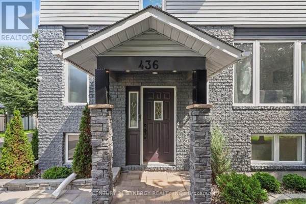 Room with a digital piano and two velvet chairs, featuring dark wood laminate flooring and a small window. - 436 Yves Street, Clarence Rockland