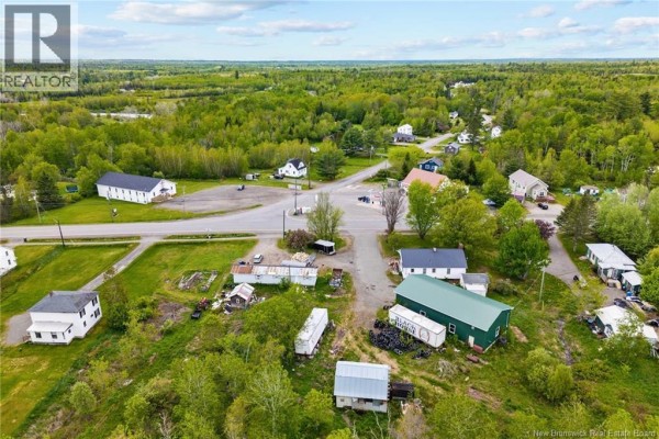 Aerial view of a rural area showing several houses, a church, and scattered outbuildings. - 4367 Heritage Drive, Tracy