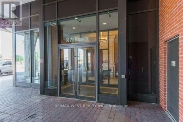 Glass entrance doors with the building address "36 Via Bagnato" above. - 437 - 36 Via Bagnato, Toronto