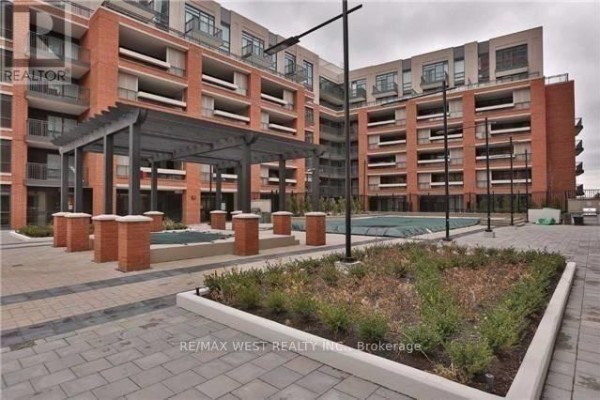 Outdoor patio area with a swimming pool and a covered seating structure. - 437 - 36 Via Bagnato, Toronto