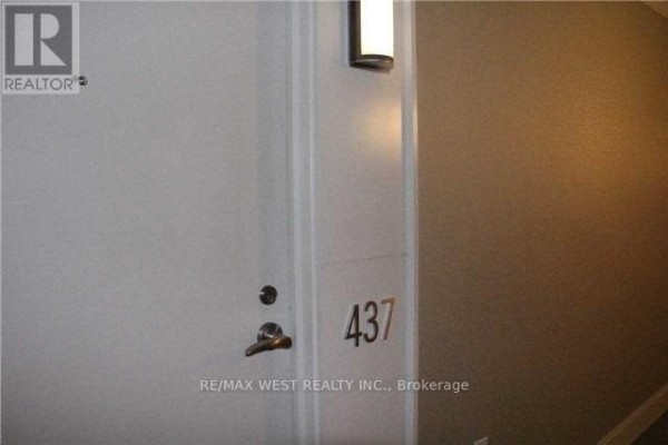 A white apartment door with the number "437" and a brushed metal handle. - 437 - 36 Via Bagnato, Toronto