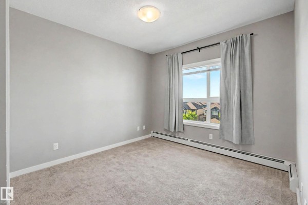 Primary Bedroom - #437 5504 Schonsee Dr Nw, Edmonton, AB T5Z0N9 Photo 3