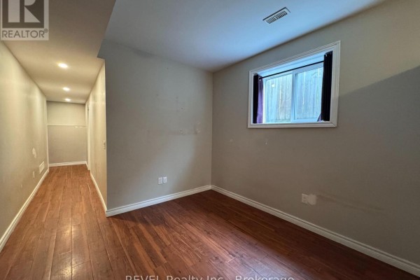 Kitchen with white cabinetry, granite countertops, stainless steel appliances, and a breakfast nook. - 438 Mcalpine Avenue N, Welland