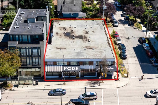Aerial view of 4384 Fraser Street Vancouver building at dusk with red outline - 4384 Fraser Street, Vancouver