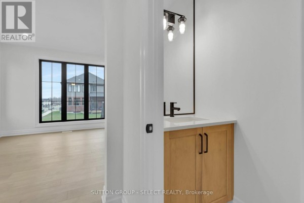 Modern bathroom vanity with wooden cabinets and white countertop - 4387 Green Bend Road London South